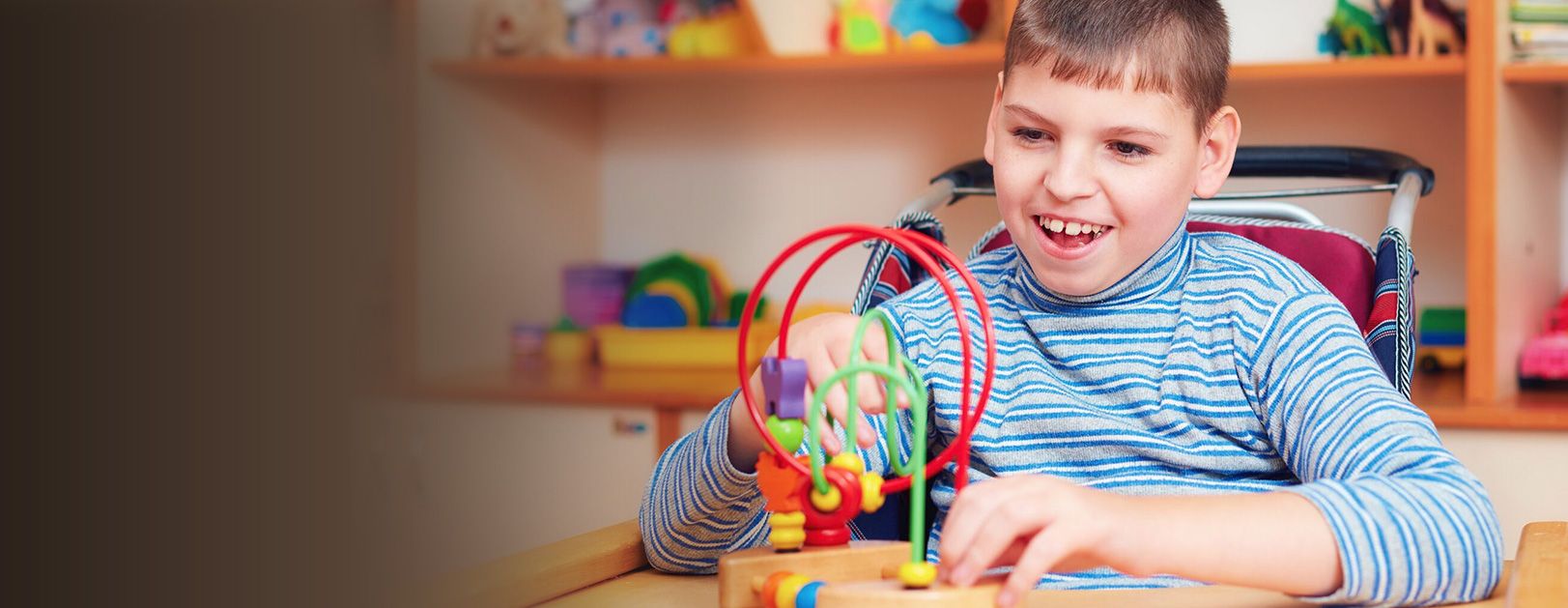 child playing with a bead maze