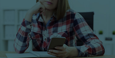 woman looking at a phone